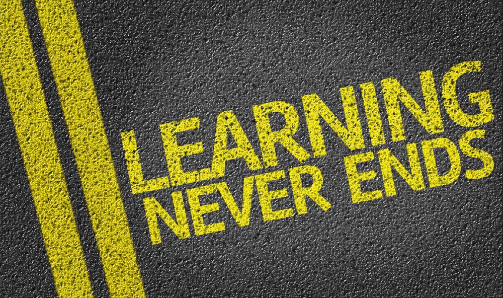 Learning Never Ends written on the road.jpeg