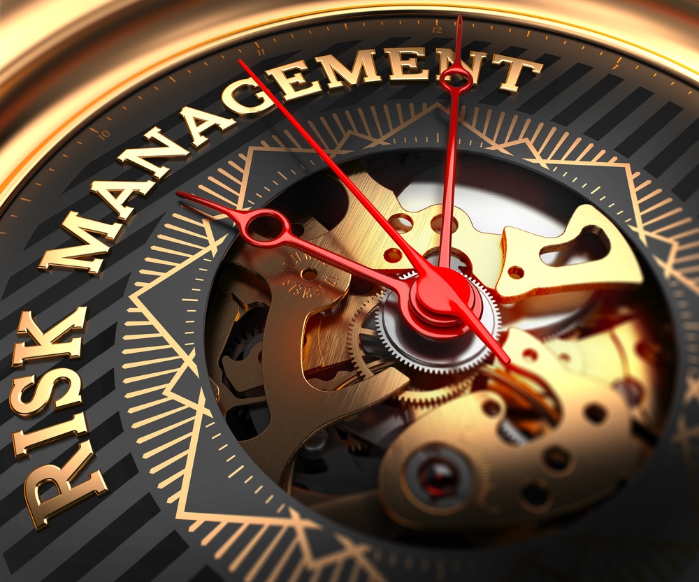 Risk Management on Black-Golden Watch Face with Closeup View of Watch Mechanism..jpeg
