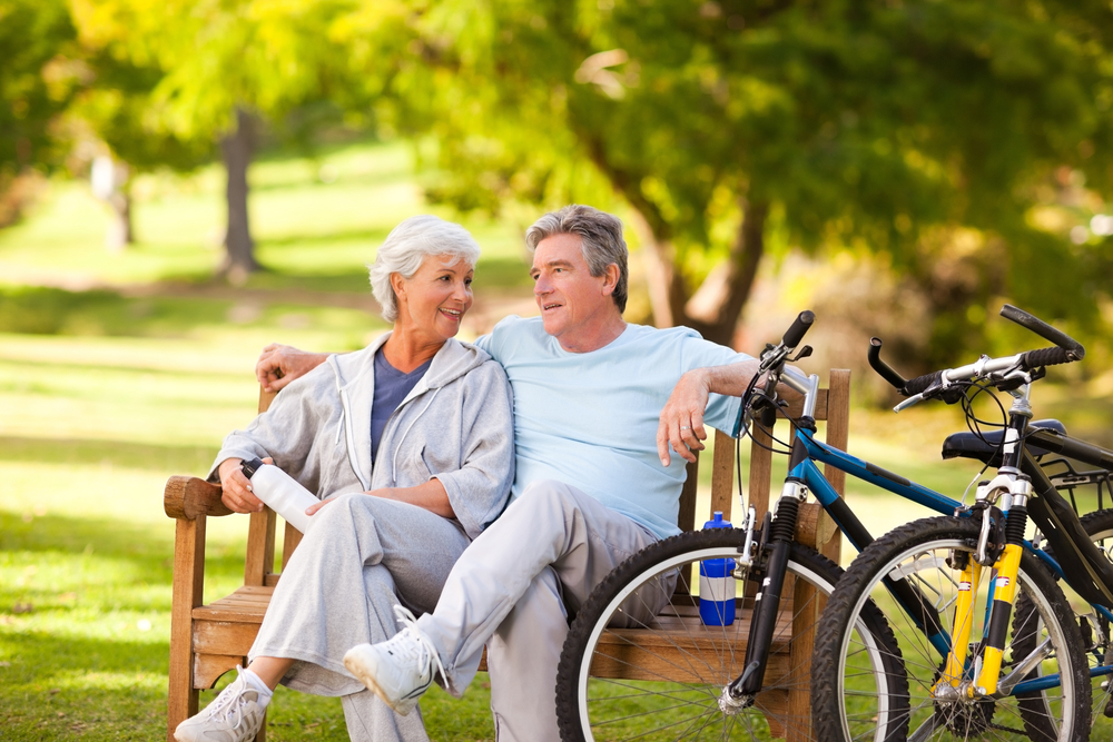 Elderly couple with their bikes-1